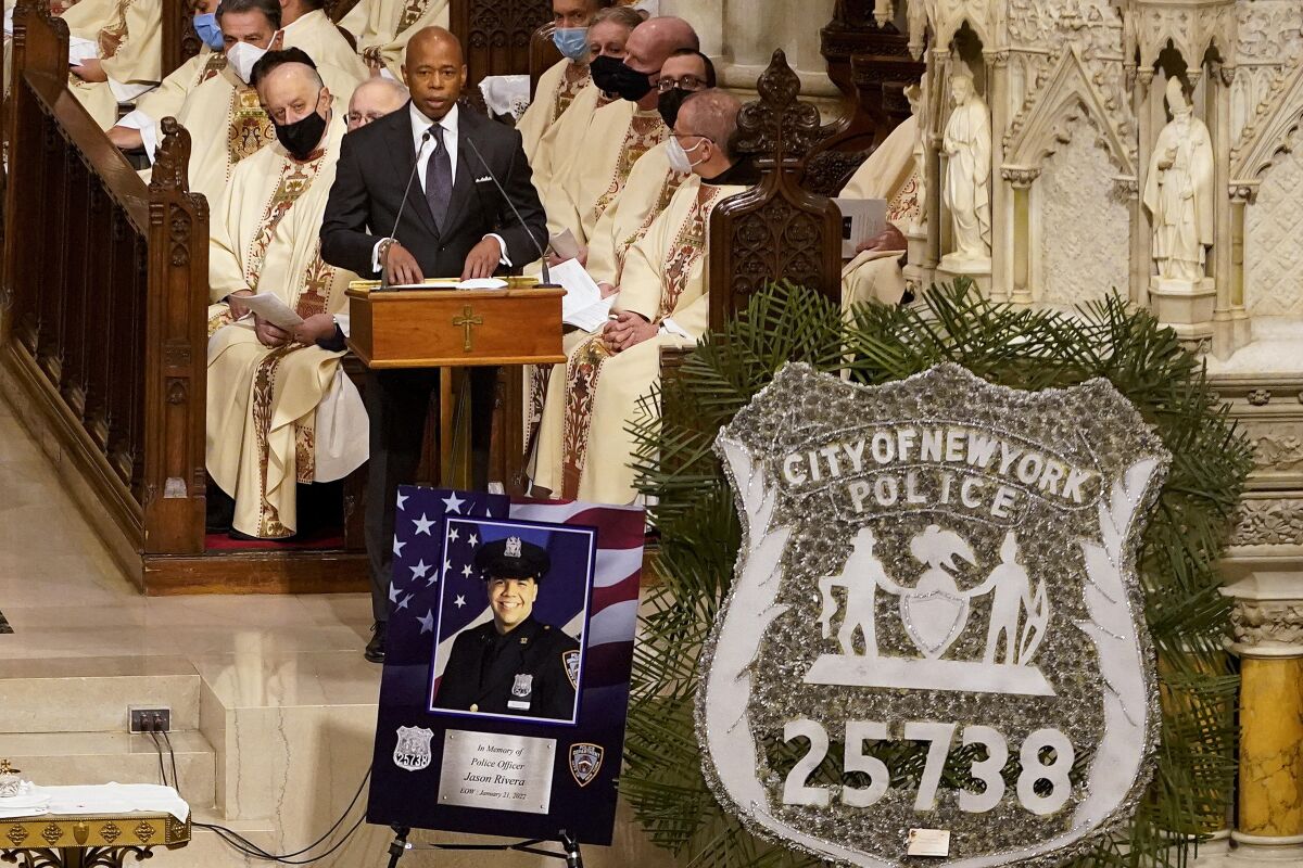 FILE — New York City Mayor Eric Adams addresses mourners during a funeral service for NYPD Officer Jason Rivera, Jan. 28, 2022, at St. Patrick's Cathedral in New York. A string of headline-making violence in New York City has frayed nerves and become a rolling trauma for Mayor Eric Adams' nascent administration. (AP Photo/Mary Altaffer, POOL, File)