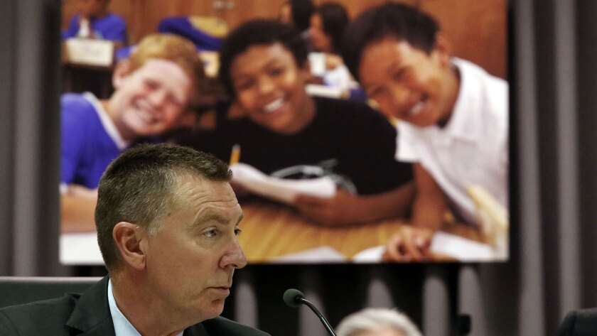 John Deasy, shown at a Board of Education meeting in August, came under fire for the iPad program.