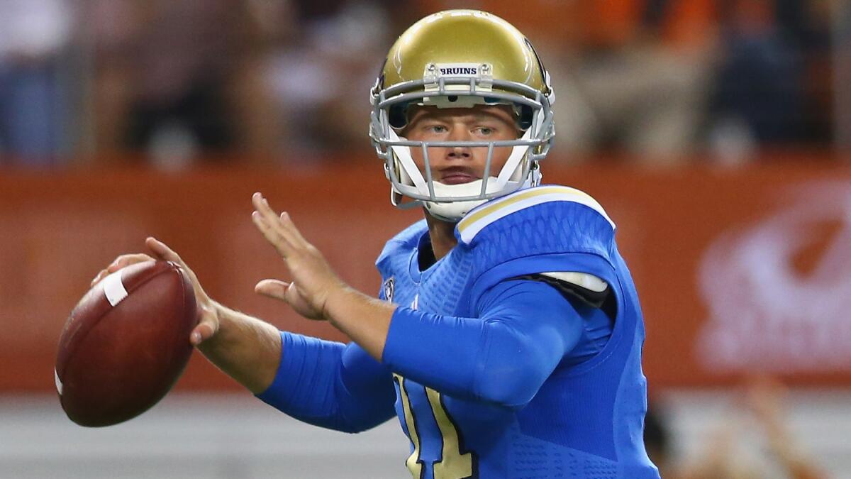 UCLA quarterback Jerry Neuheisel looks to pass during the Bruins' win over Texas on Saturday.