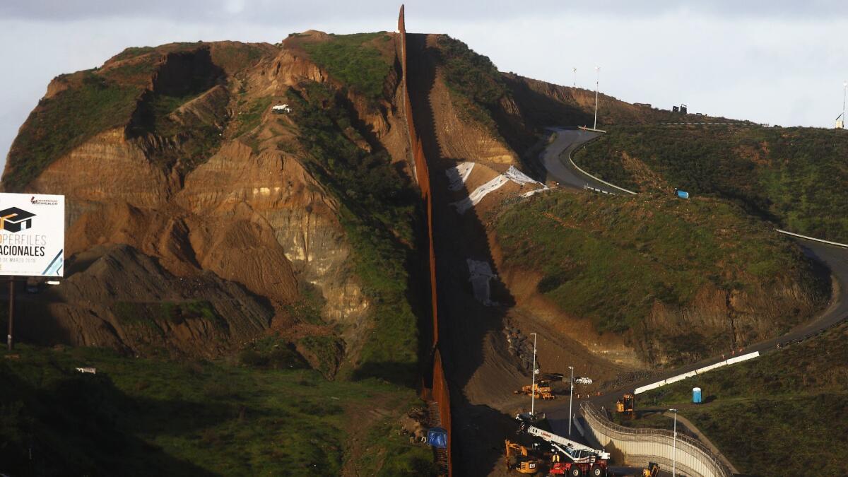 The U.S.-Mexico border barrier stands on a hillside in Tijuana, Mexico.