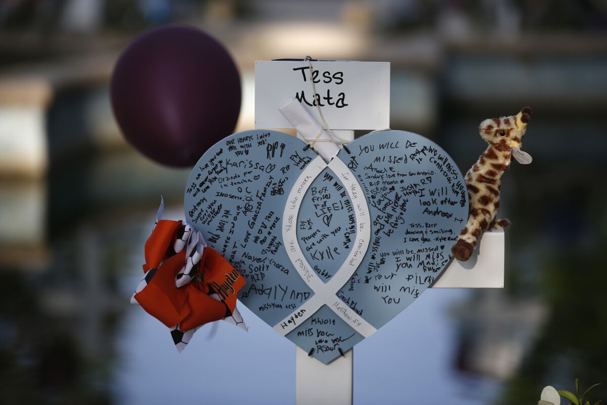 Tess Mata's cross stands at a memorial site for the victims killed in this week's shooting at Robb Elementary School in Uvalde, Texas, Friday, May 27, 2022. (AP Photo/Dario Lopez-Mills)