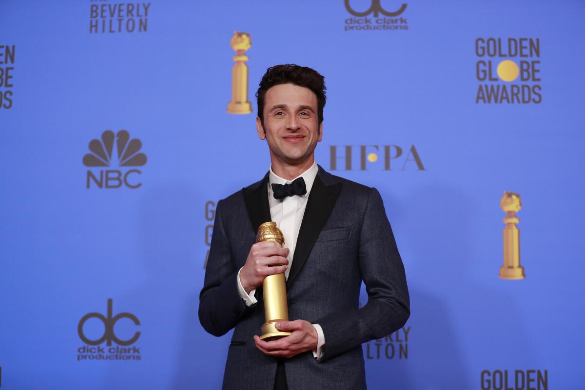 Justin Hurwitz with his Golden Globe for original score.