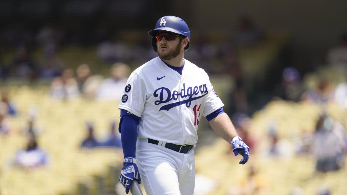 Max Muncy returns to the Dodgers dugout after an at-bat against the San Francisco Giants on May 31.