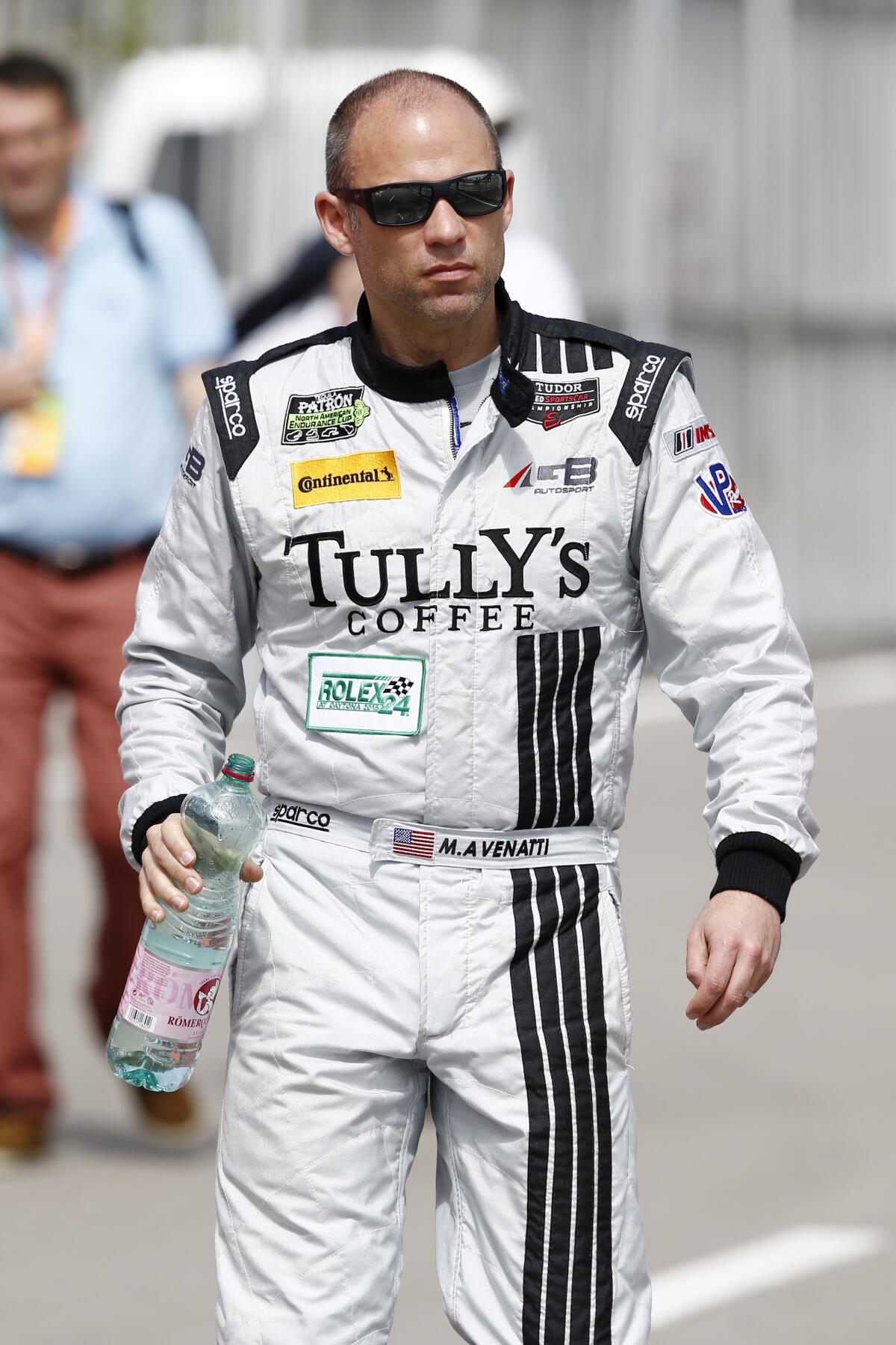 Michael Avenatti in a car racing suit