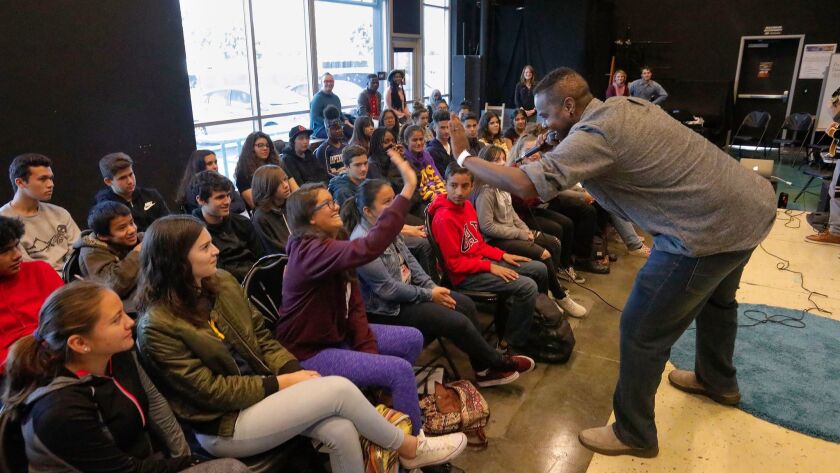 Gill Sotu performs "Black Boy Joy," his piece from Intrepid Theatre's "Exiled Voices: The Refugee Art Project," at Bayfront Charter High School in Chula Vista.