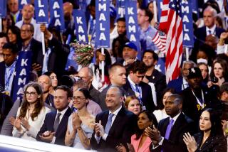 US Second Gentleman Doug Emhoff, center, and other family members listen as US Vice President Kamala Harris speaks during the Democratic National Convention (DNC) at the United Center in Chicago, Illinois, US, on Thursday, Aug. 22, 2024. The DNC this week marks the ceremonial crowning of Vice President Kamala Harris and Minnesota Governor Tim Walz as the party's presidential nominees, capping off a whirlwind month for Democrats who quickly coalesced behind the new ticket after President Joe Biden dropped out of the race in July. Photographer: Eva Marie Uzcategui/Bloomberg via Getty Images