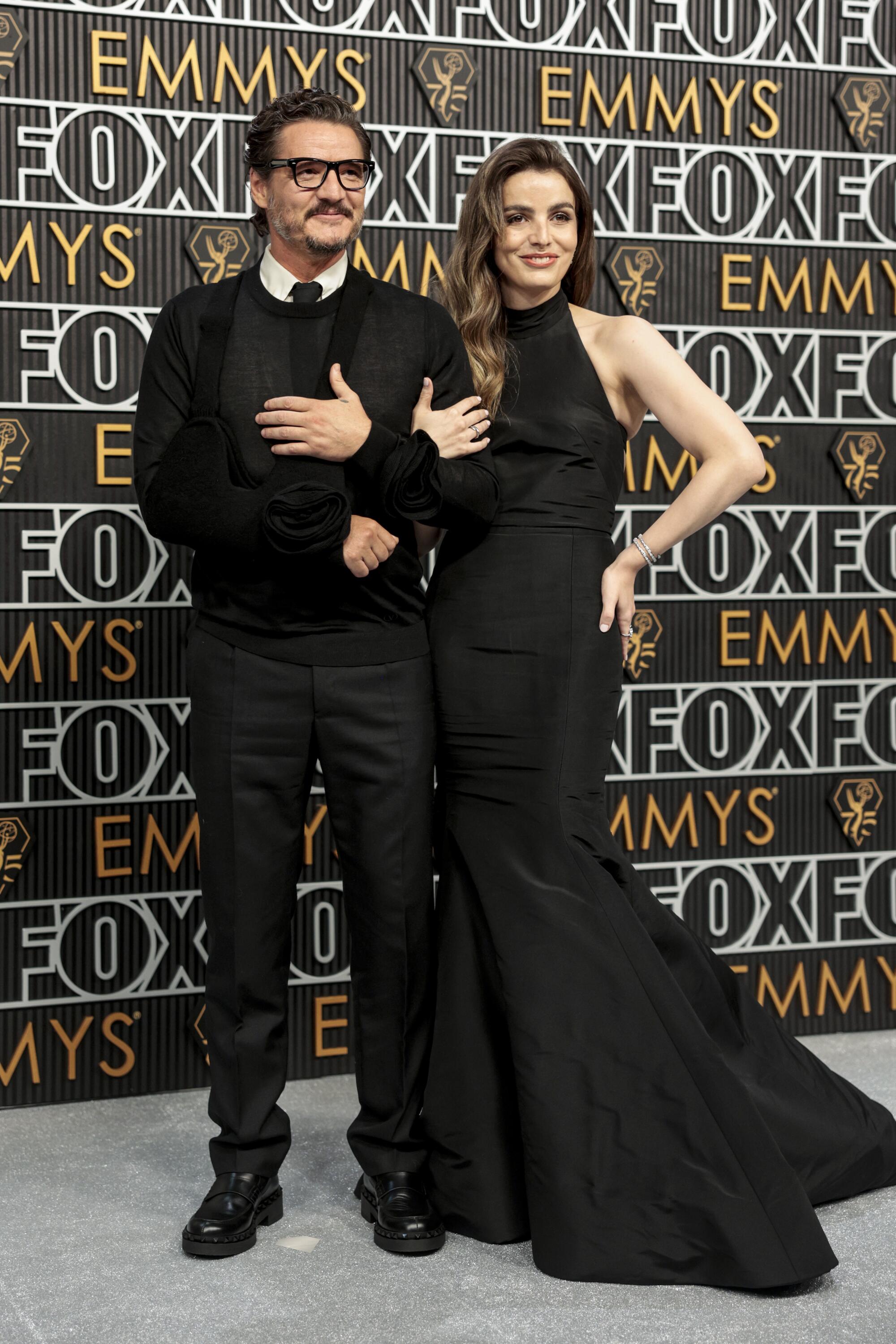 Pedro Pascal and Lux ​​Pascal pose on the Emmys red carpet. 