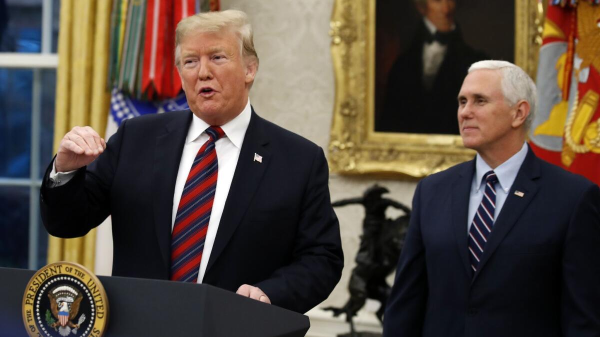 President Trump and Vice President Mike Pence at a naturalization ceremony in the Oval Office of the White House in Washington on Jan. 19.