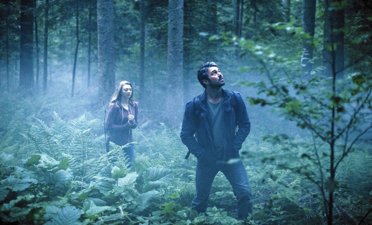 Natalie Dormer and Taylor Kinney in "The Forest."