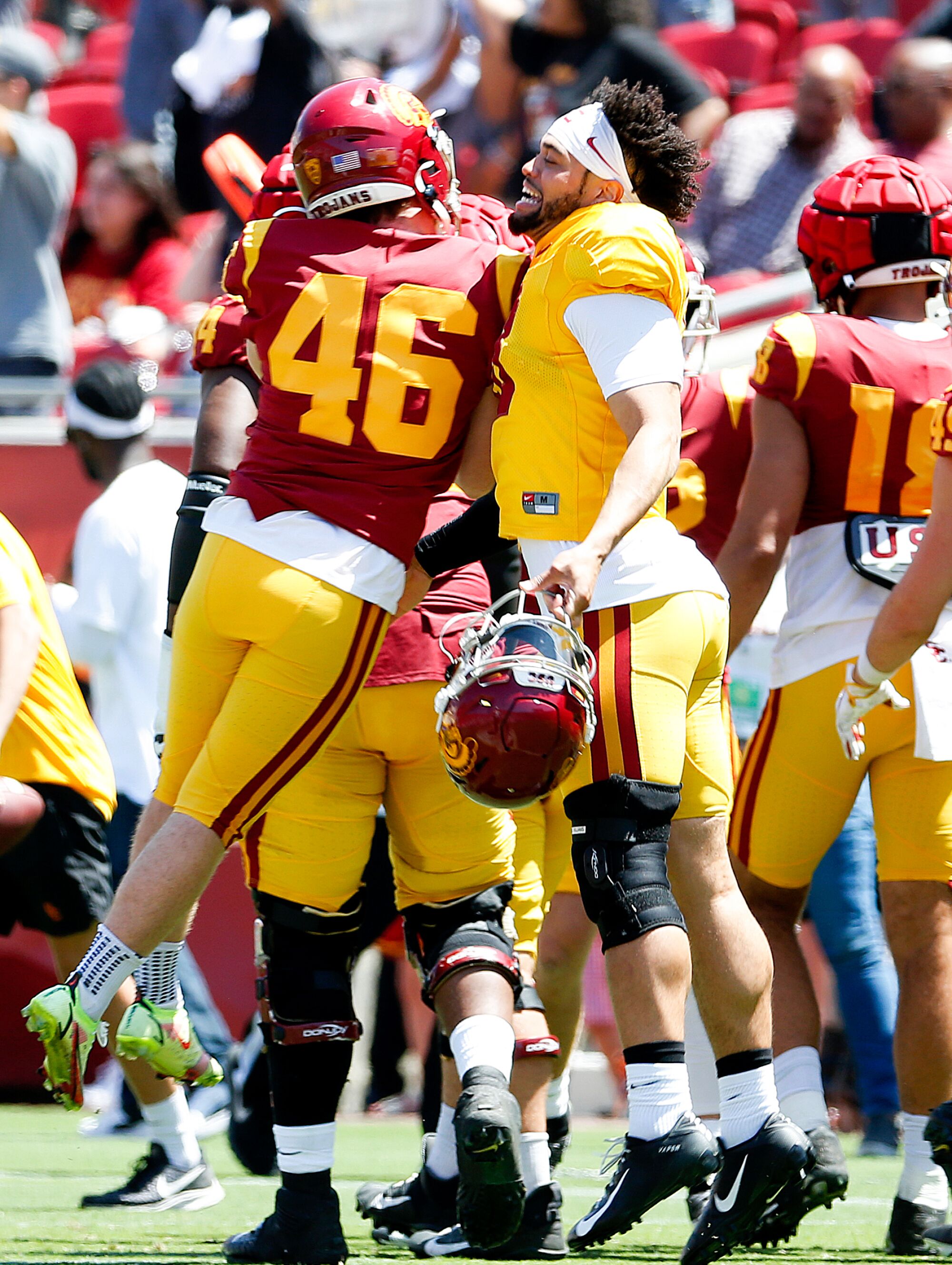 Denis Lynch and Caleb Williams chest bump.