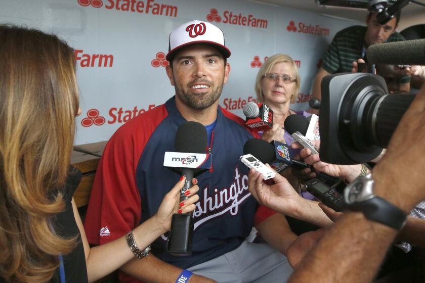 David DeJesus speaks with reporters before his first game with the Washington Nationals on Monday.