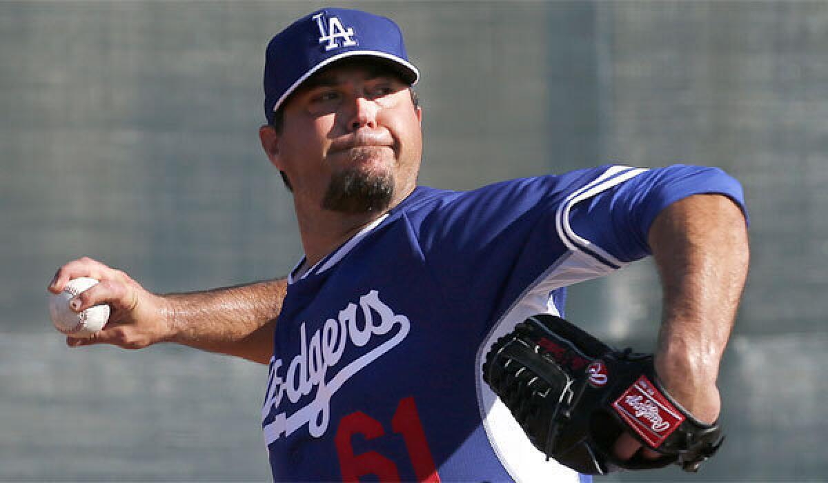 Josh Beckett, who is dealing with a sprained thumb on his pitching hand, is still listed as the starting pitcher for the Dodgers' game against the Chicago Cubs on Friday.