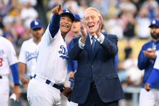 Dodgers manager Dave Roberts and Vin Scully