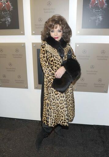 Actress Joan Collins attends Mercedes-Benz Fashion Week.