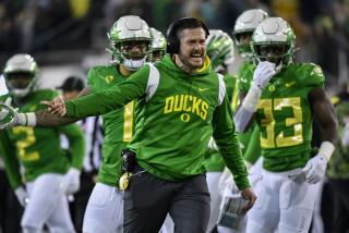 Oregon coach Dan Lanning argues with an official after a call during a 2022 game against Utah