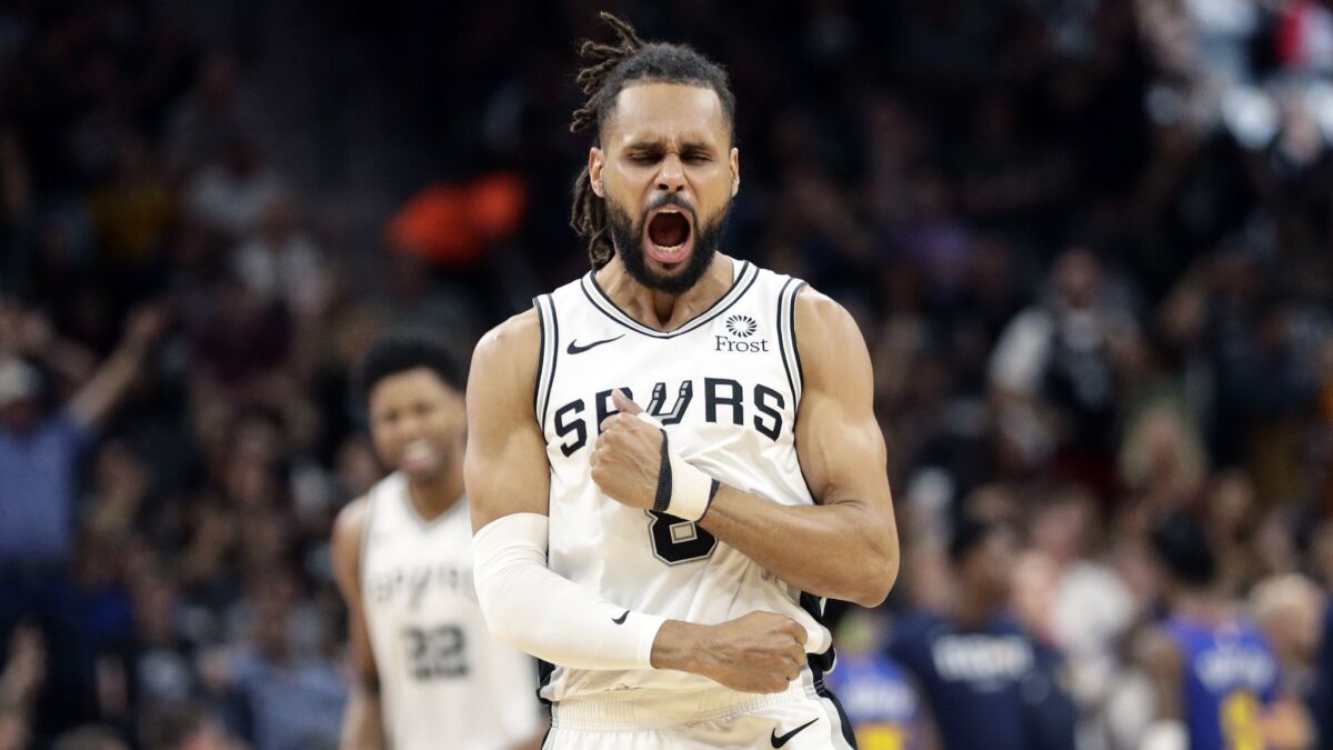 San Antonio Spurs guard Patty Mills (8) celebrates a score against the Denver Nuggets during the second half of Game 6.