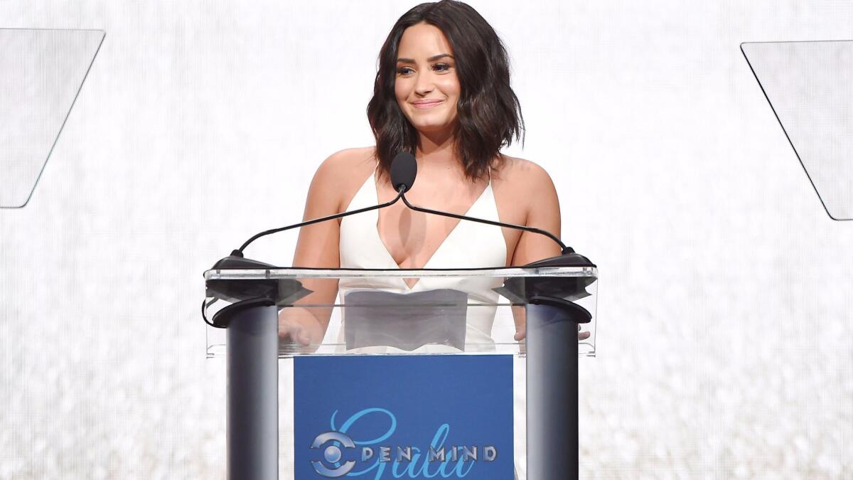 Honoree Demi Lovato accepts the Artistic Award of Courage onstage during UCLA Semel Institute's Open Mind Gala at the Beverly Hilton Hotel on March 22 in Beverly Hills.