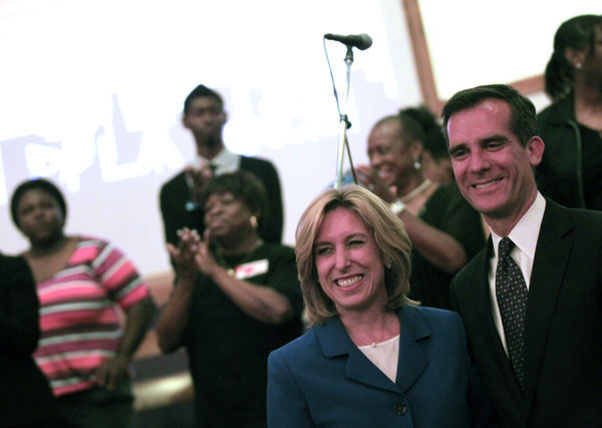 Mayoral candidates Wendy Gruel and Eric Garcetti after a candidate forum at Macedonia Baptist Church.