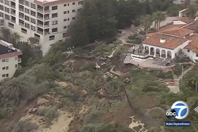 FILE - This image from KABC7 video shows an aerial view of a landslide on the western side of the Casa Romantica and Cultural Center and Gardens in San Clemente, Calif., on April 27, 2023. Passenger rail service has been restored along a section of the Southern California coast a month after a landslide damaged a historic building and threatened seaside tracks. Amtrak's Pacific Surfliner service and regional Metrolink trains resumed travel through the Orange County city of San Clemente during the Memorial Day weekend, both railroads announced on their websites. (KABC7 via AP, File)