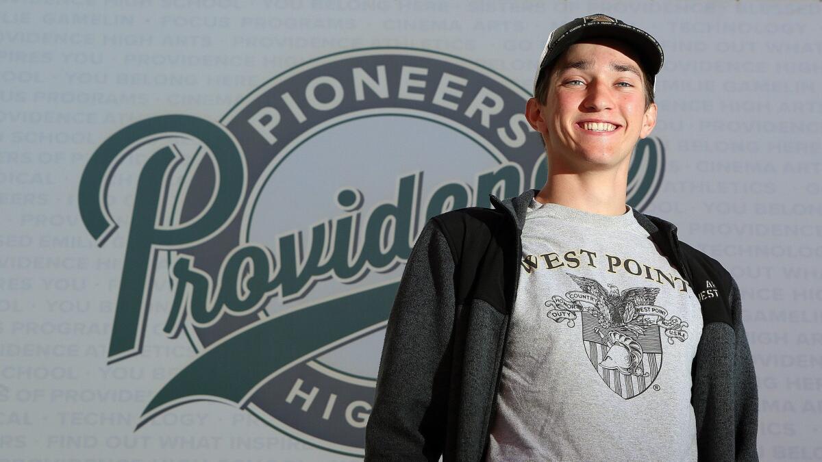 Providence High School graduating senior Conrad Davis, wearing a West Point T-shirt, sweatshirt, and cap, served as the ASB president, a member of the cross-country team, choir, and drama performances. He also has a 4.0 GPA and is heading to West Point.