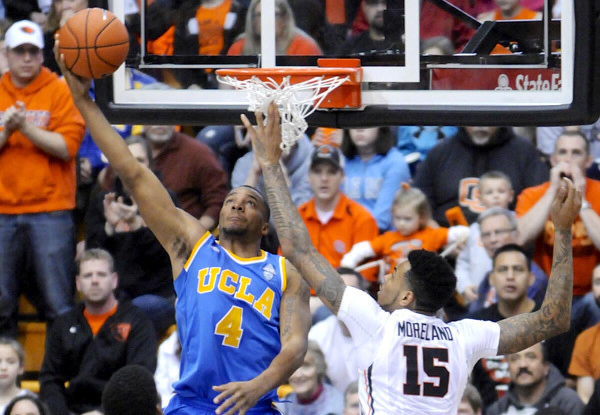 UCLA guard Norman Powell looks to dunk against Oregon State's Eric Moreland during a Pac-12 Conference game last month in Corvallis.