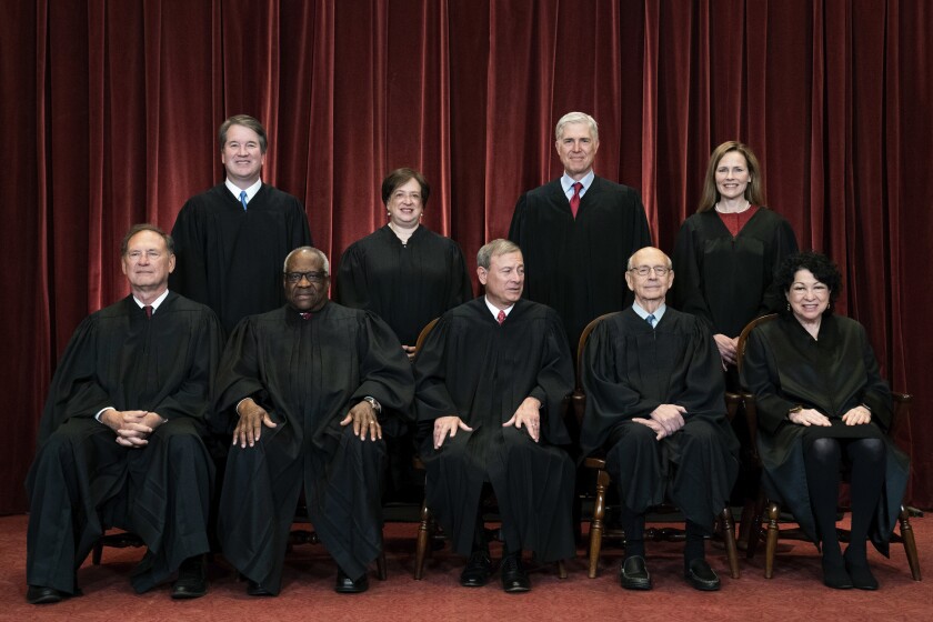 FILE - In this April 23, 2021, file photo, members of the Supreme Court pose for a group photo at the Supreme Court in Washington. Seated from left are Associate Justice Samuel Alito, Associate Justice Clarence Thomas, Chief Justice John Roberts, Associate Justice Stephen Breyer and Associate Justice Sonia Sotomayor, while standing from left are Associate Justice Brett Kavanaugh, Associate Justice Elena Kagan, Associate Justice Neil Gorsuch and Associate Justice Amy Coney Barrett. (Erin Schaff/The New York Times via AP, Pool)
