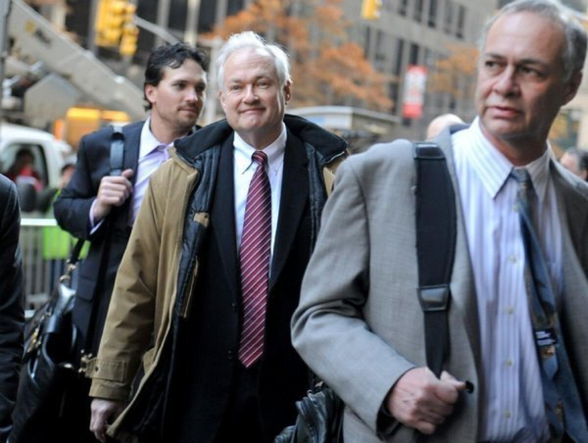 NHL Players' Association executive director Donald Fehr, center, arrives for labor talks at NHL headquarters in New York with his brother, NHLPA counsel Steven Fehr, right, Wednesday.