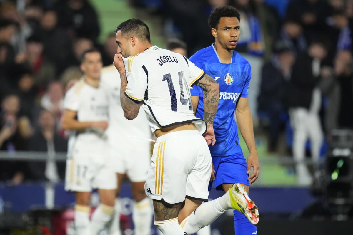 Real Madrid's Joselu celebrates after scoring his sides first goal during the Spanish La Liga soccer 