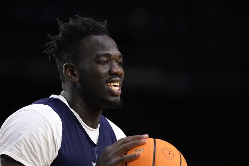 Connecticut forward Adama Sanogo practices for their Final Four college basketball game in the NCAA Tournament on Friday, March 31, 2023, in Houston. Connecticut and Miami play on Saturday. (AP Photo/Brynn Anderson)