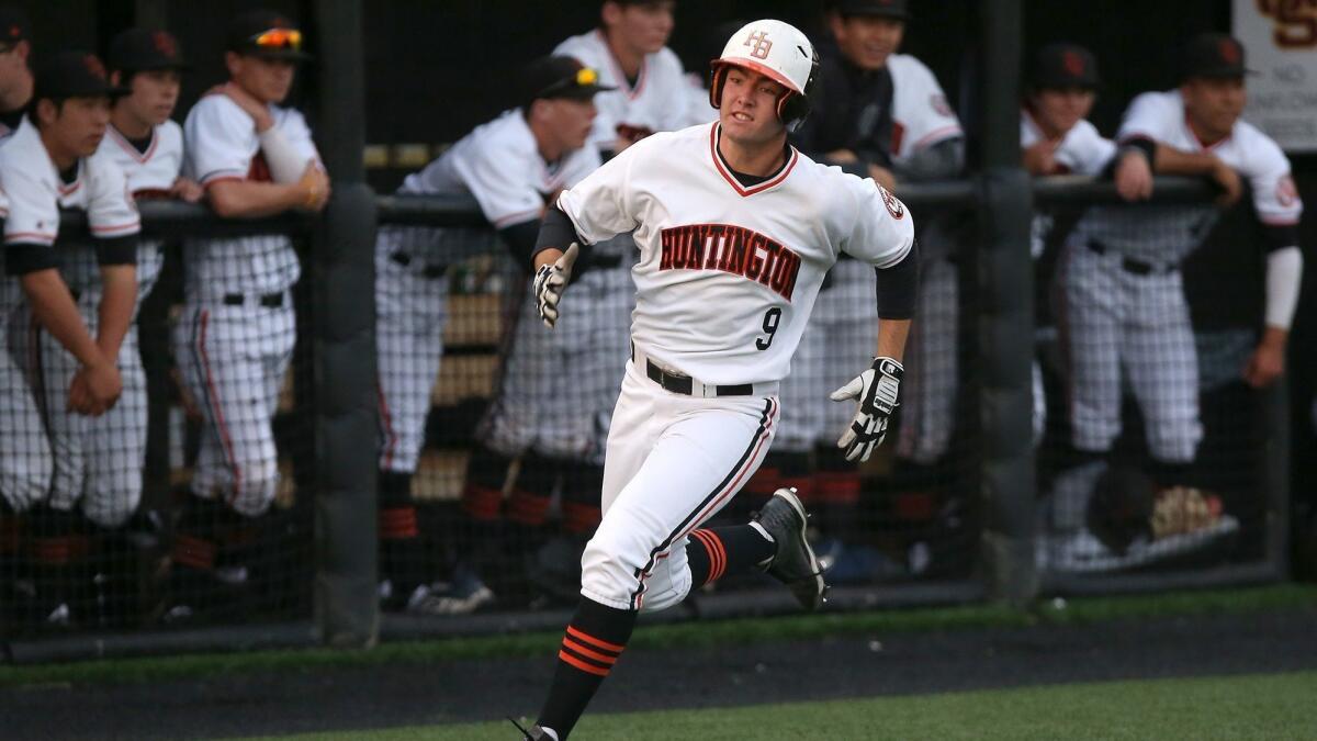 Josh Hahn, shown scoring a run on April 6, went two for three with a home run and three runs batted in during Huntington Beach High's 7-0 win over Marina on Friday.