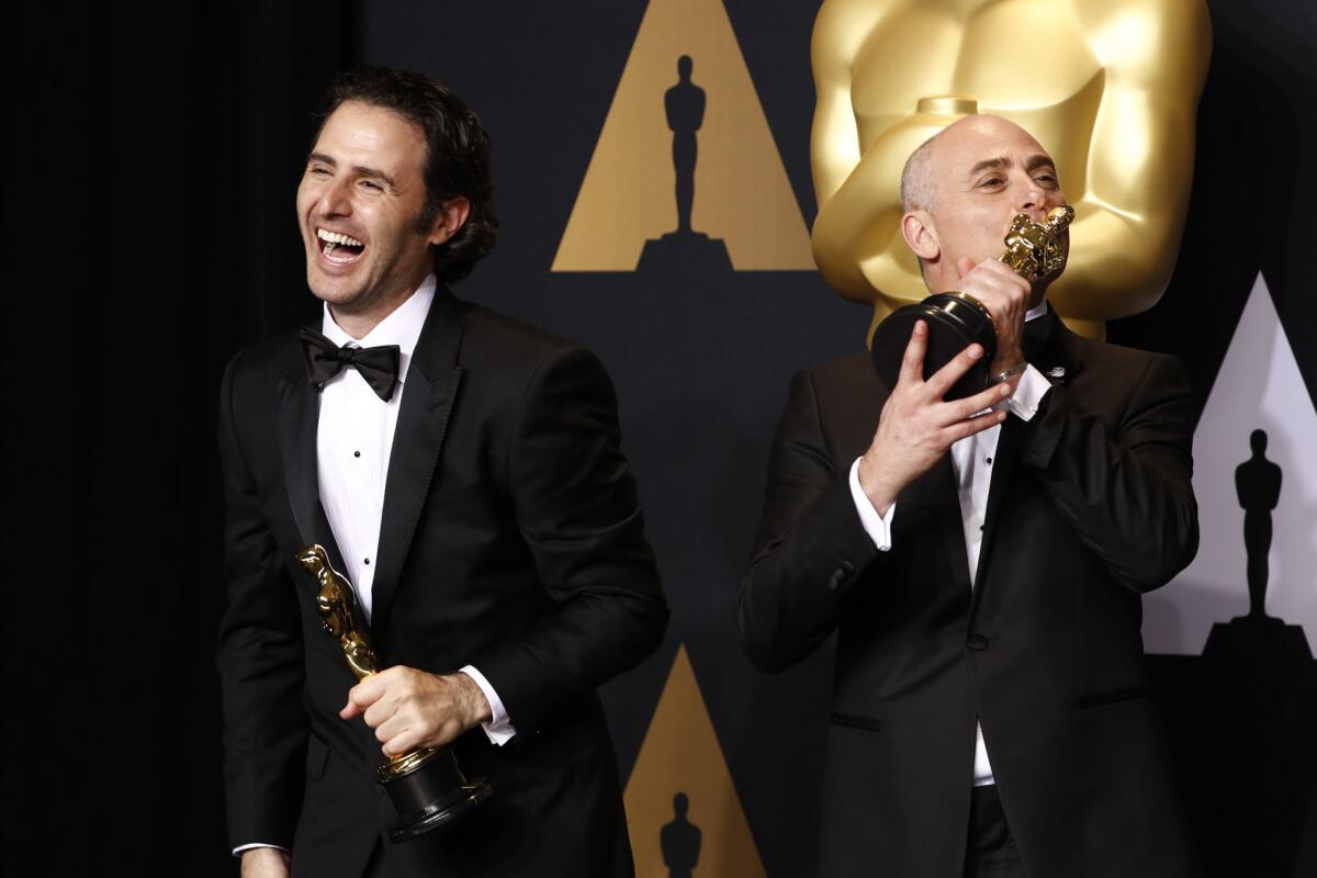 Marc Sondheimer and Alan Barillaro onstage at the Oscars.