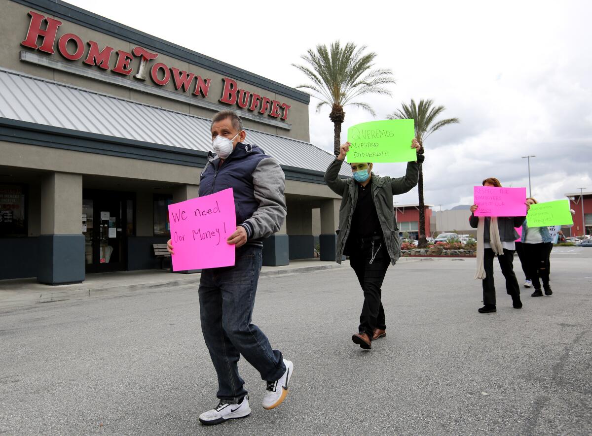 Employees at the Hometown Buffet in Burbank staged a protest on Wednesday after the company rescinded their March 25 paychecks without notice.