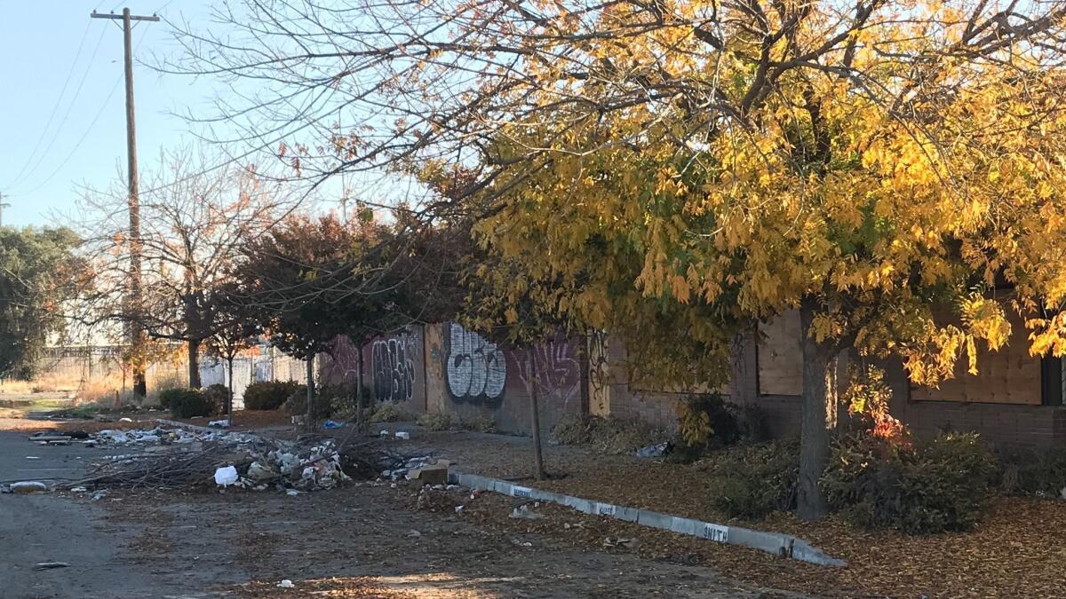 A rail property is strewn with trash in Fresno.