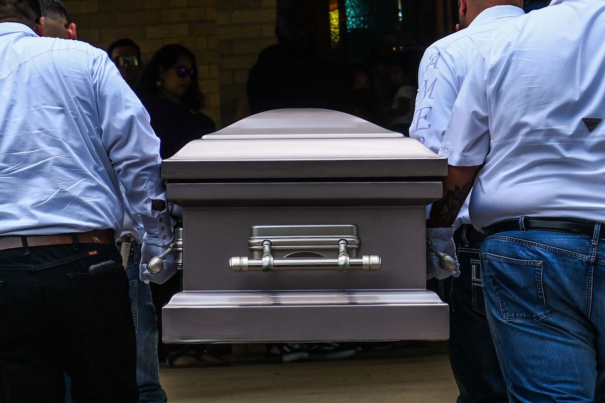 Pallbearers carry the casket of Amerie Jo Garza, who died in the mass shooting in Uvalde.