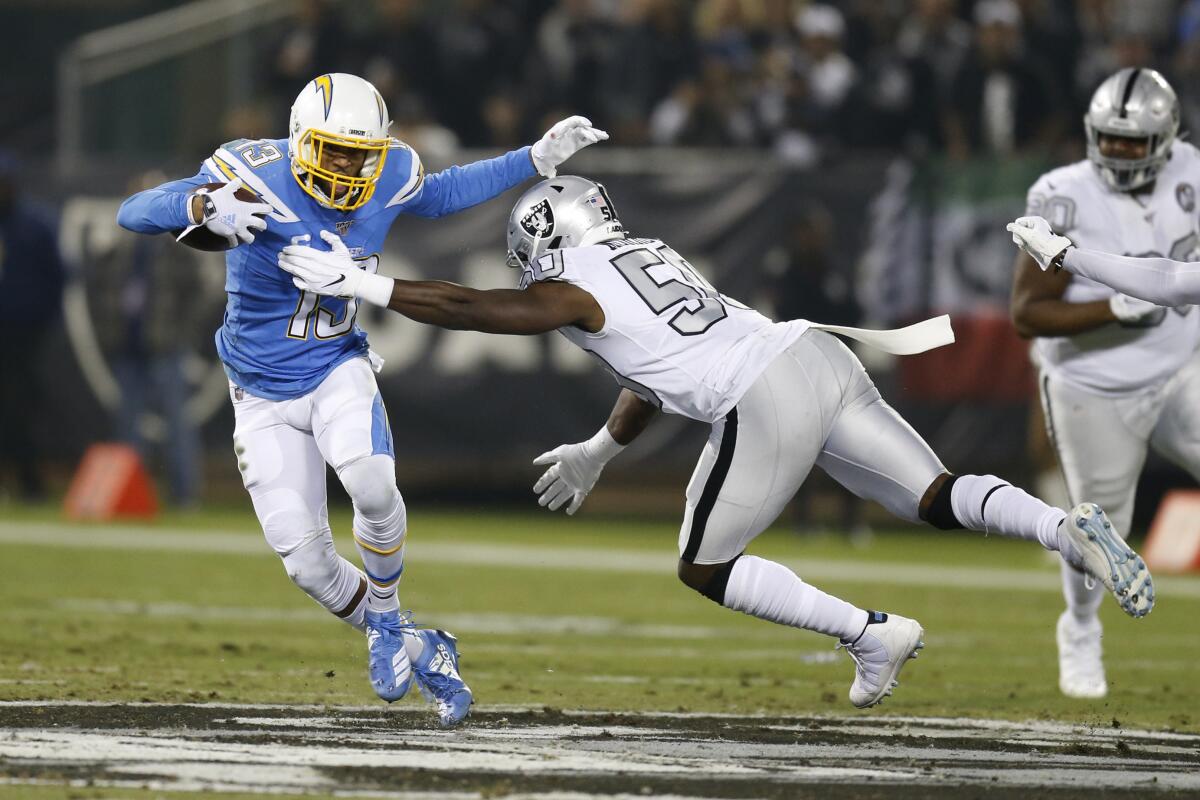 Chargers wide receiver Keenan Allen tries to evade Nicholas Morrow