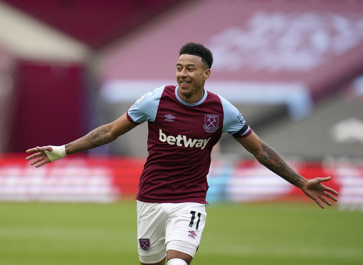FILE - West Ham's Jesse Lingard celebrates after scoring his side's opening goal during the English Premier League soccer match between West Ham United and Leicester City at the London Stadium in London, Sunday, April 11, 2021. Nottingham Forest has pulled off its biggest signing since clinching a return to the Premier League by bringing in Jesse Lingard on a free transfer. The signing of the English midfielder became official on July, 21, 2022. (John Walton/Pool via AP, File)