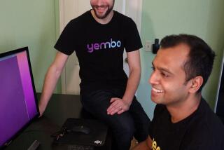 Zach Rattner and Sid Mohan working on an AI software product at Yembo, the company they co-founded.