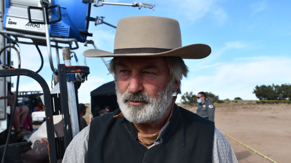 Alec Baldwin wears a cowboy hat on the set of the film "Rust."