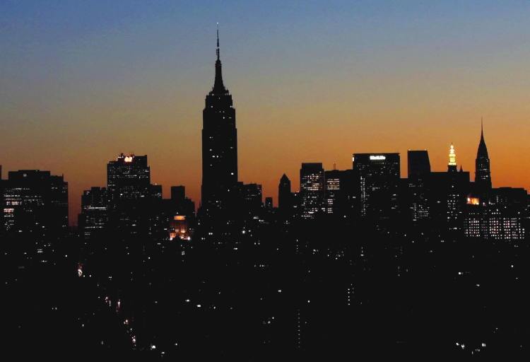 Dawn breaks over the New York City skyline.