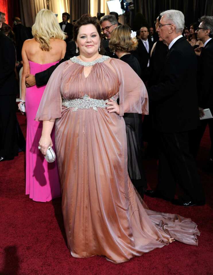 The tent-like shape and dreary dusty rose color of Melissa McCarthy's Marina Rinaldi gown did nothing for her.