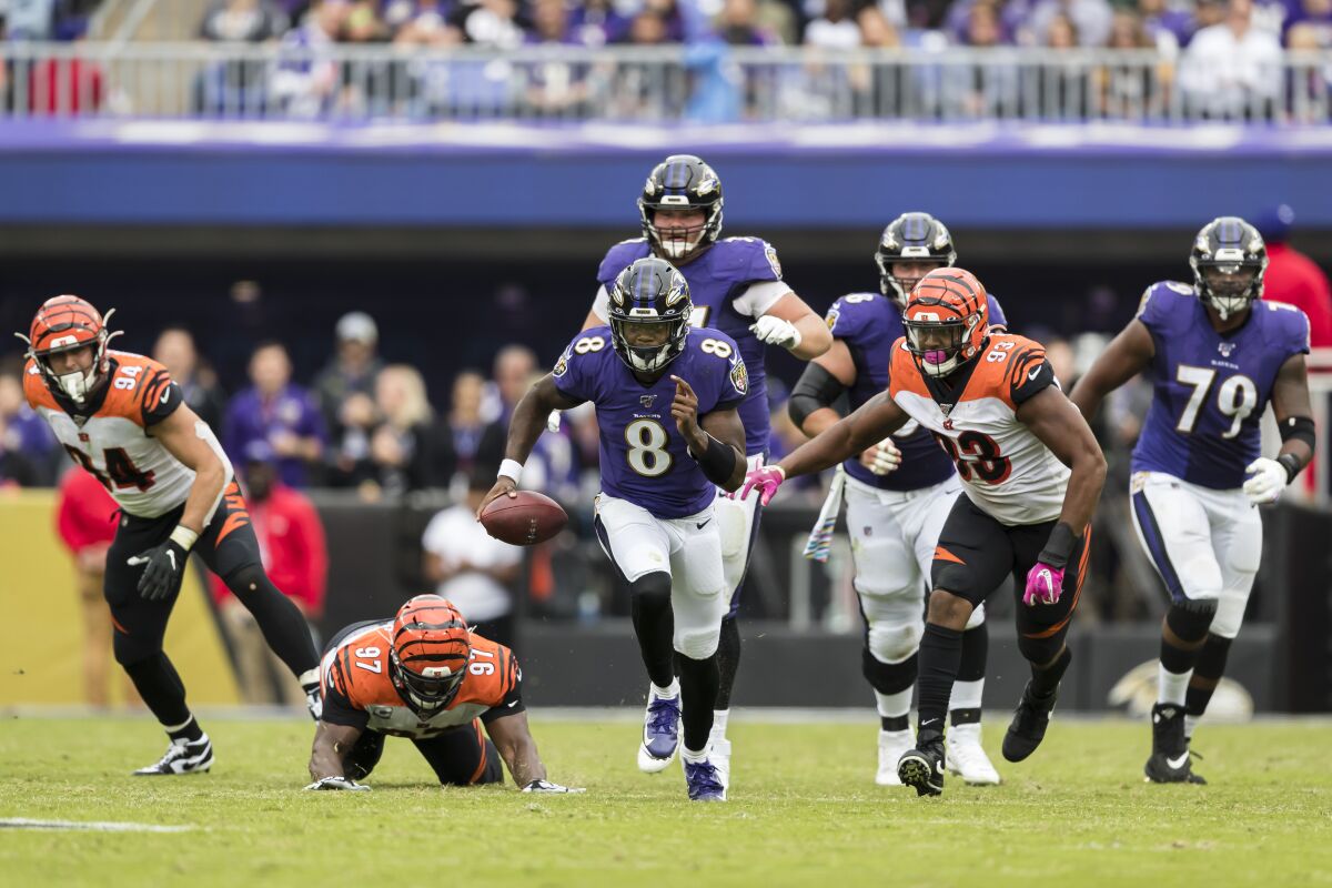 Baltimore Ravens quarterback Lamar Jackson scrambles against the Bengals on Sunday.