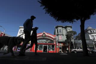 SAN FRANCISCO CA - OCT. 22, 2020. Pedestrians walk along Haight Street in San Francisco on Thursday, Aug. 22, 2020. San Francisco has done an excellent job following public health guidance and made a huge leap from the coronavirus orange tier to the less restrictive yellow tier, providing a pathway for more businesses and activities to reopen. (Luis Sinco / Los Angeles Times)