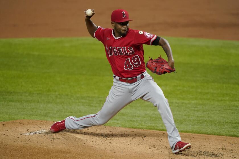 Los Angeles Angels starting pitcher Julio Teheran throws to a Texas Rangers batter during the first inning of a baseball game in Arlington, Texas, Wednesday, Sept. 9, 2020. (AP Photo/Tony Gutierrez)
