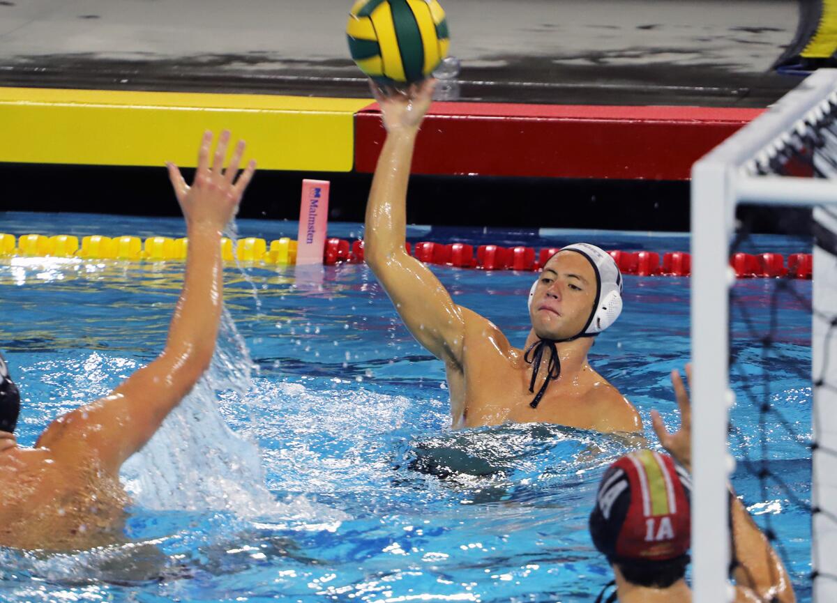 Newport Harbor's Kai Kaneko (13) passes during Saturday's Open Division title match against JSerra.