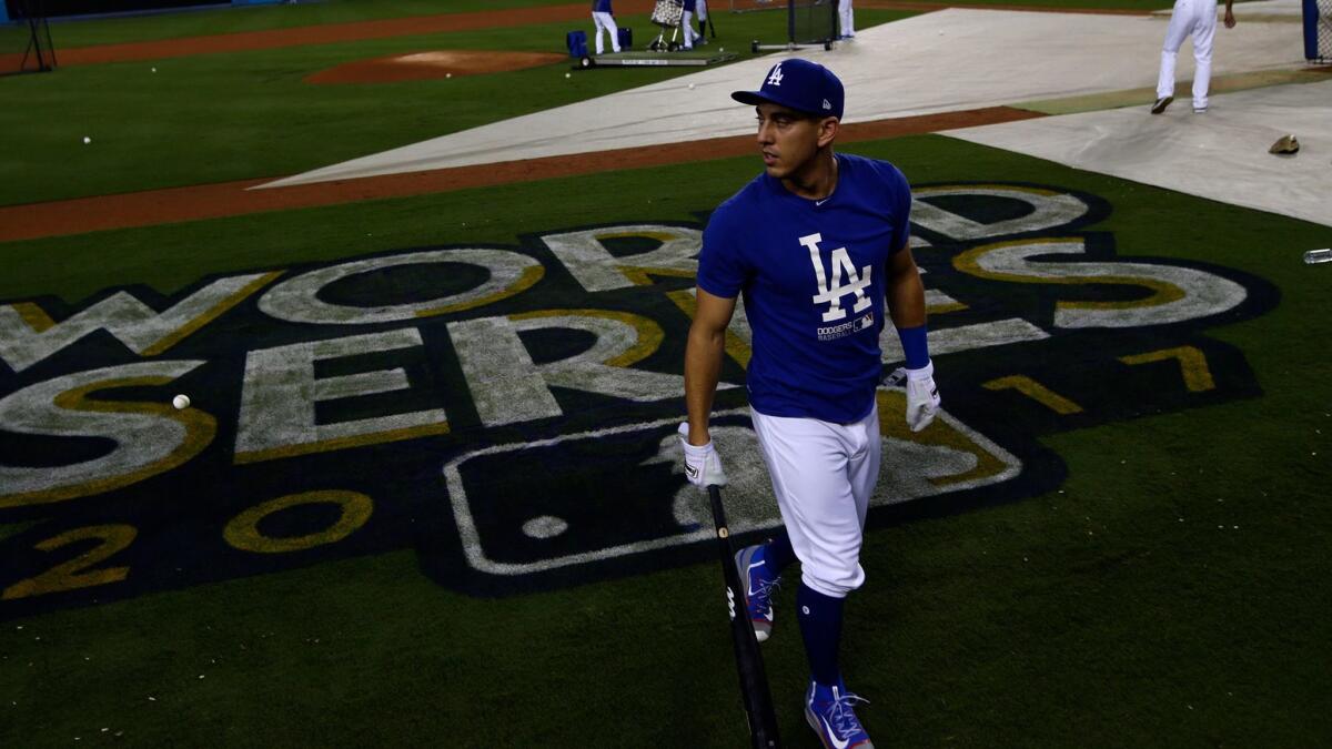 Dodgers catcher Austin Barnes walks off after batting practice during a team workout two days before Game 1 of the 2017 World Series.