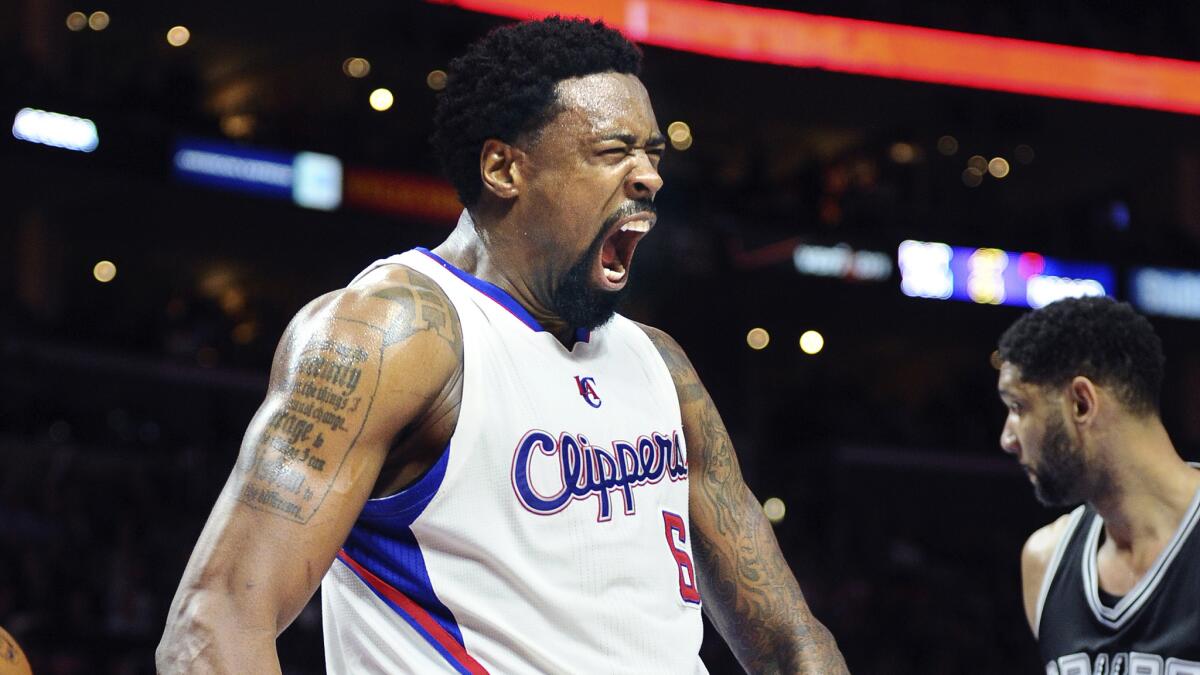 Clippers center DeAndre Jordan celebrates after dunking against the San Antonio Spurs on Feb. 19.