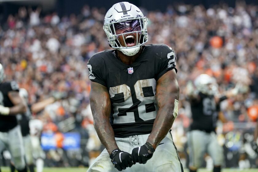 Las Vegas Raiders running back Josh Jacobs (28) celebrates his touchdown against the Denver Broncos during the second half of an NFL football game, Sunday, Oct. 2, 2022, in Las Vegas. (AP Photo/Abbie Parr)