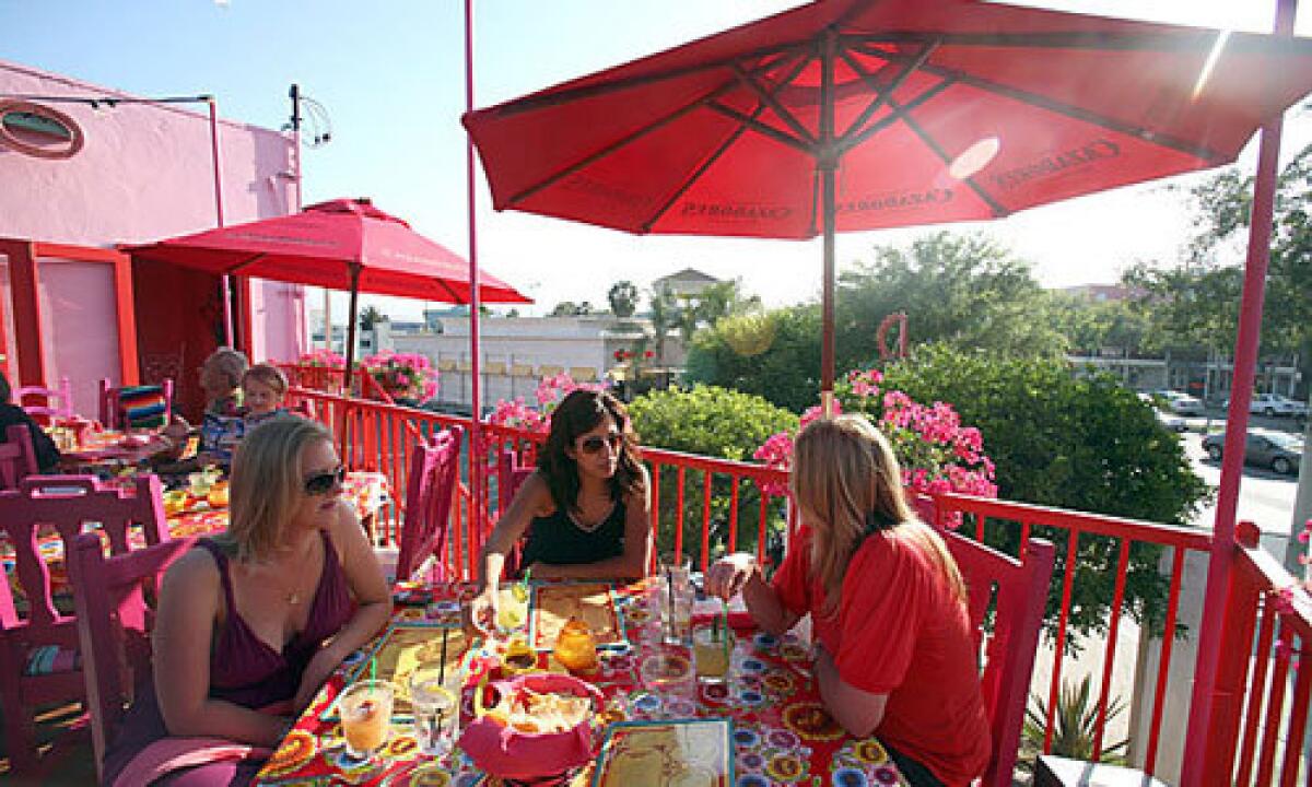 Diners enjoy food and drinks on the patio at Mexico, a new Mexican restaurant in West Hollywood.