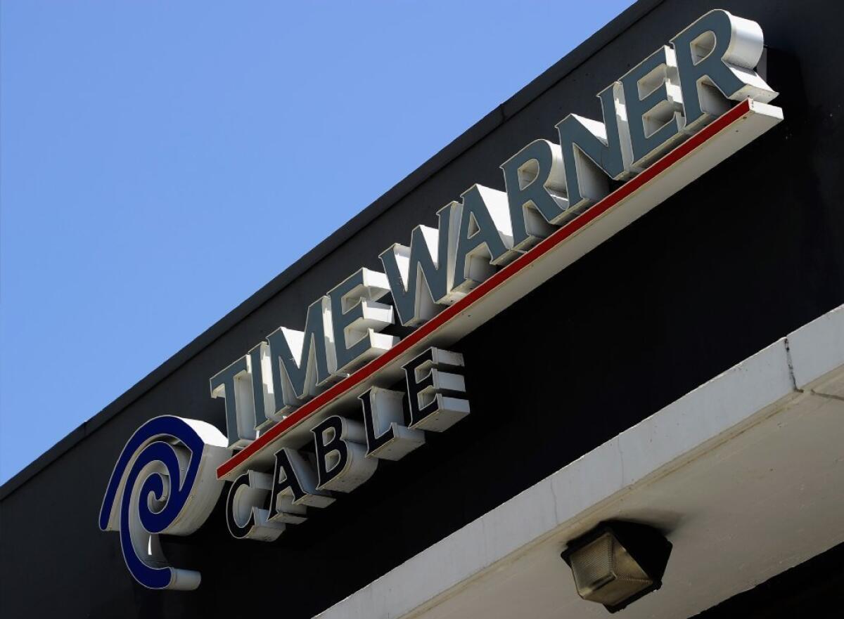 A sign hangs on a Time Warner Cable office on August 3, 2011 in Los Angeles, California.