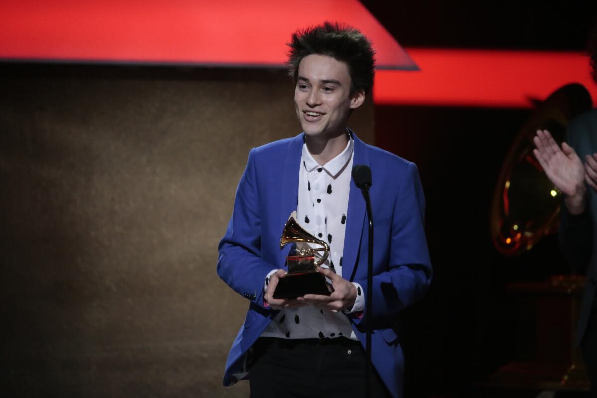 Jacob Collier holds a Grammy statuette at the 2017 Grammy Awards.